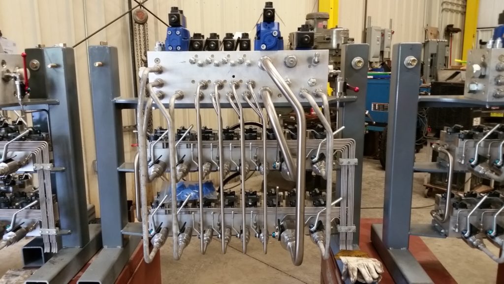 CUSTOM HYDRAULIC MANIFOLDS, WITH SAFETY BLOCKS.  FABRICATED  WITH STAINLESS STEEL TUBING AND FITTINGS.